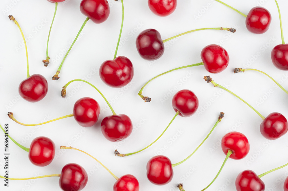 Many red fresh cherries on white background Many red fresh cherries on white background