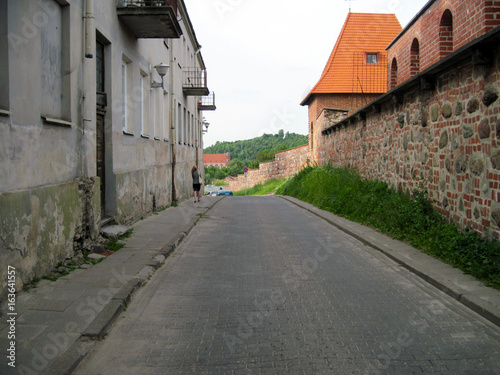 Road in Vilnius, old brick wall, old house