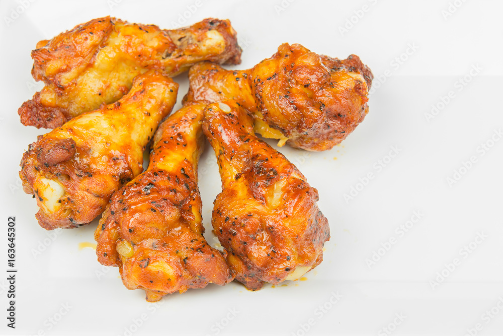 chicken upper wing (drumette) fried in a white plate, close up chicken upper wing (drumette) fried in a white plate, close up