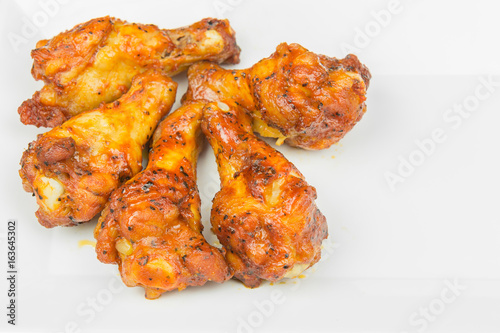 chicken upper wing (drumette) fried in a white plate, close up