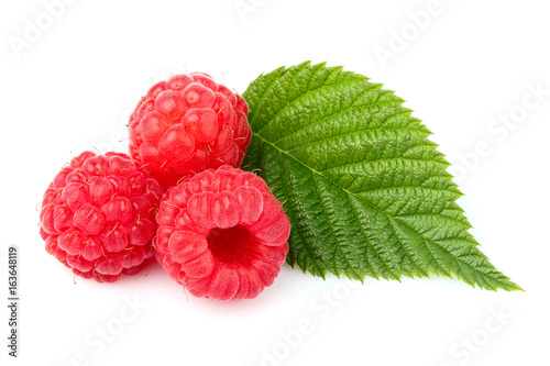 Raspberry with leaf isolated on white background.