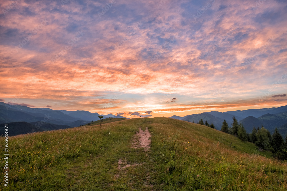Footpath in the mountains at sunset