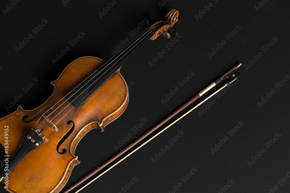 Old violin on a black background Old violin on a black background