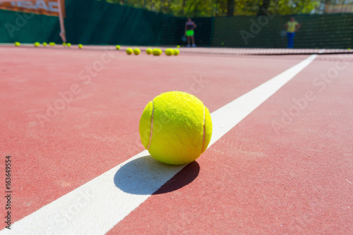 Tennis Balls on the Court © fotofabrika