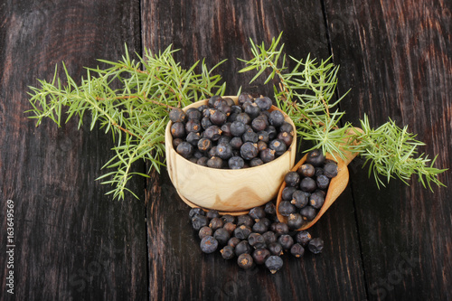 juniper berries on wooden background