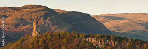 The National Wallace Monument standing on the top of Abbey Craig rock with the Ochil Hills at the background. Stirling, Scotland, UK photo