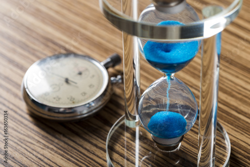 Time is passing. Blue hourglass close up © fotofabrika
