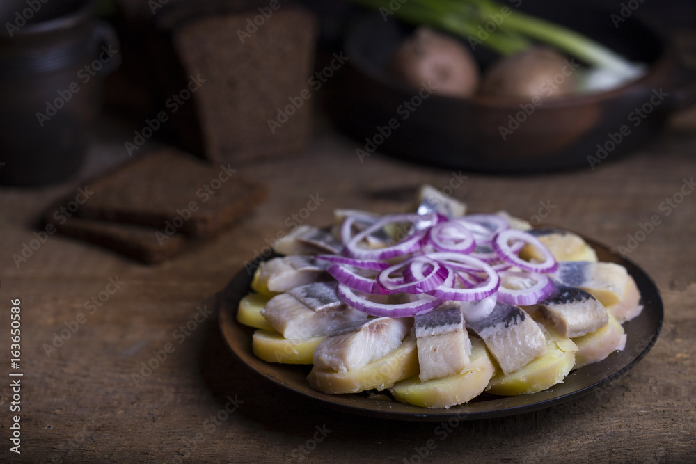 Salted herring with potatoes and onions