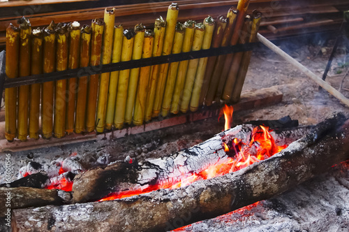 Lemang is a traditional food made of glutinous rice, coconut milk and salt, cooked in a hollowed bamboo stick lined with banana leaves in order to prevent the rice from sticking to the bamboo photo