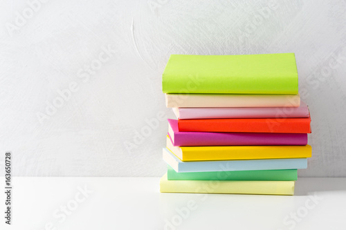 pile of paperback books on a table