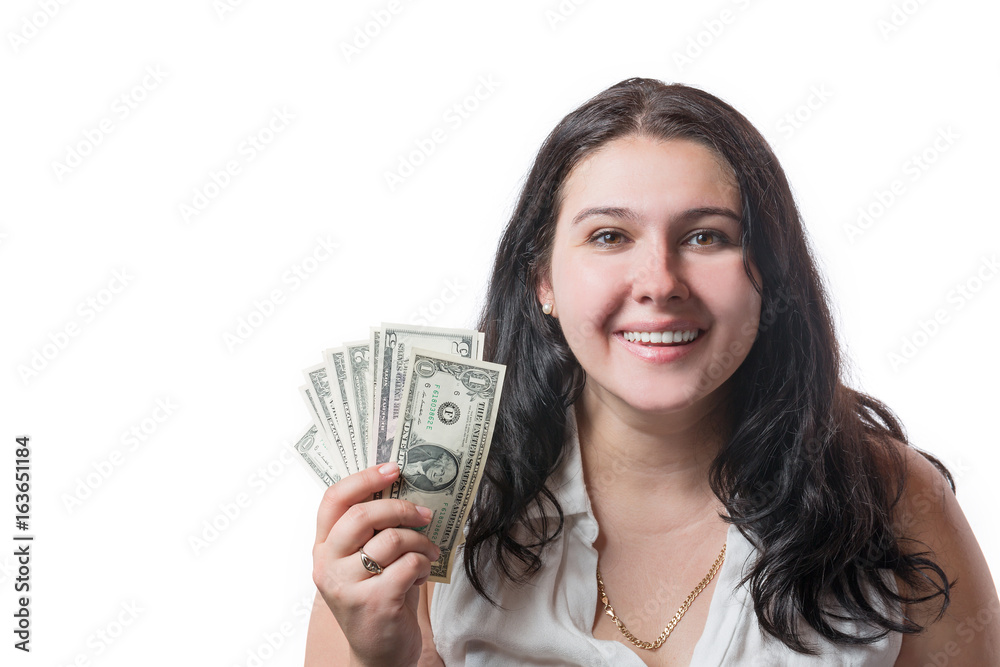 Happy smiling young brunette woman holding american dollar money isolated on white. Positive emotions and happiness concept Happy smiling young brunette woman holding american dollar money isolated on white. Positive emotions and happiness concept