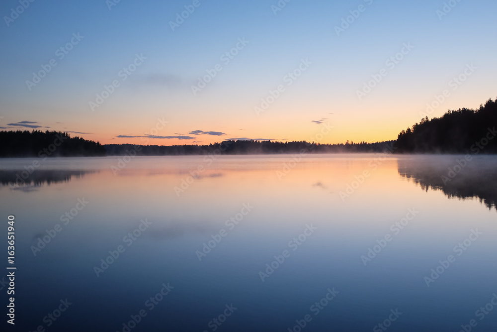 Midnight sun landscape in Finland. Sunset colors at 1 am.