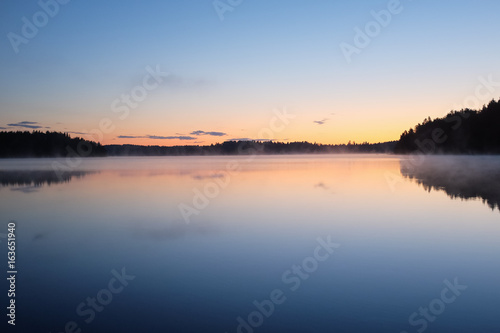 Midnight sun landscape in Finland. Sunset colors at 1 am.