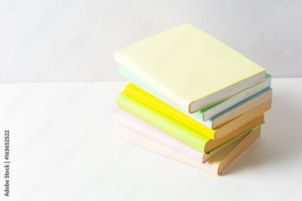 pile of paperback books on a table pile of paperback books on a table