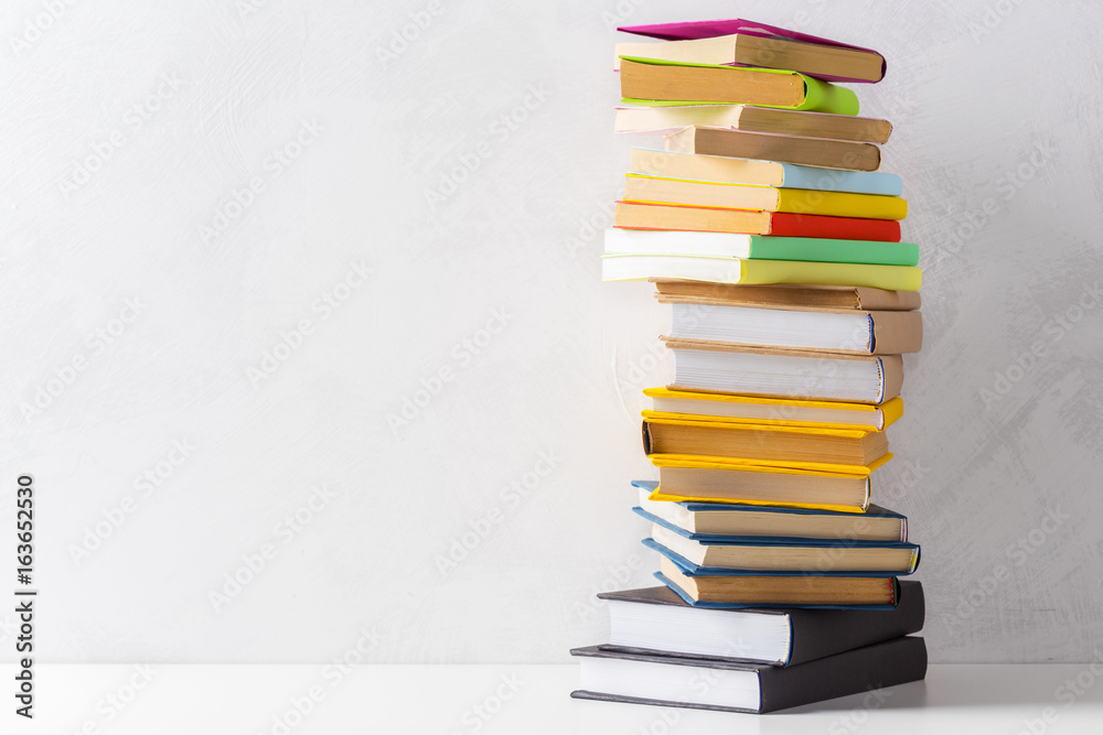 pile of paperback books on a table pile of paperback books on a table