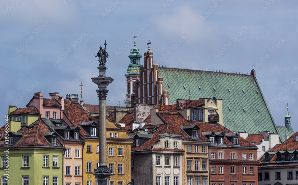 Sigismund's Column in Warsaw, Poland and Old Town rooftops