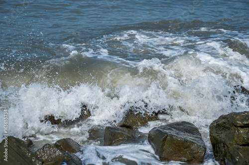 Waves on the coastal stones of the Black Sea, Poti, Georgia