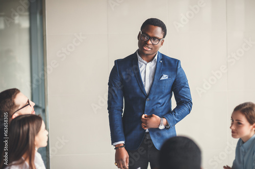 peaceful african american businessman in office photo