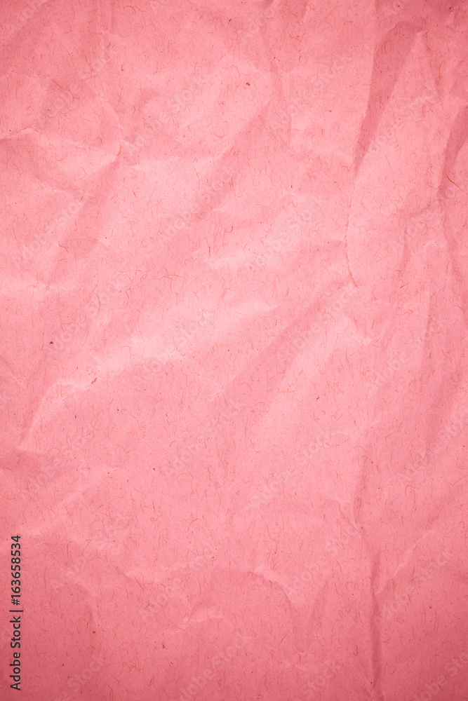 Crumpled recycle pink paper background. Crumpled recycle pink paper background.