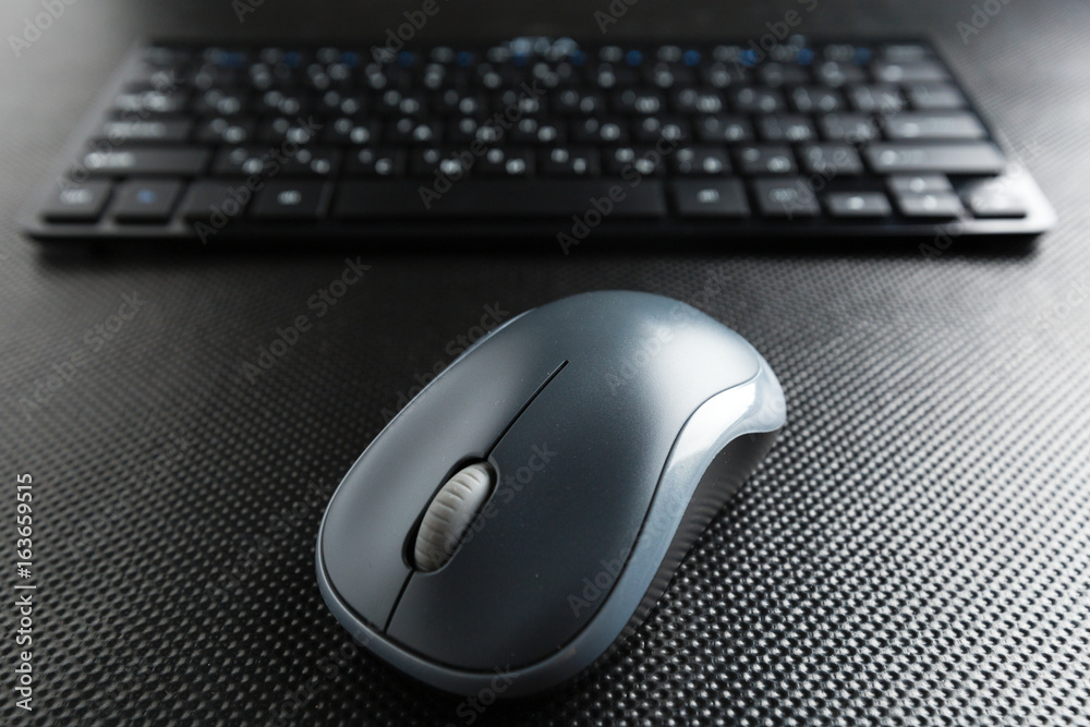 keyboard and mouse on the table . keyboard and mouse on the table .