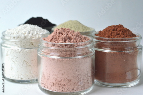 Cosmetic clays and powders for beauty face masks and skin detox - French green clay, red clay, kaolin, pink clay and powdered activated charcoal
 photo