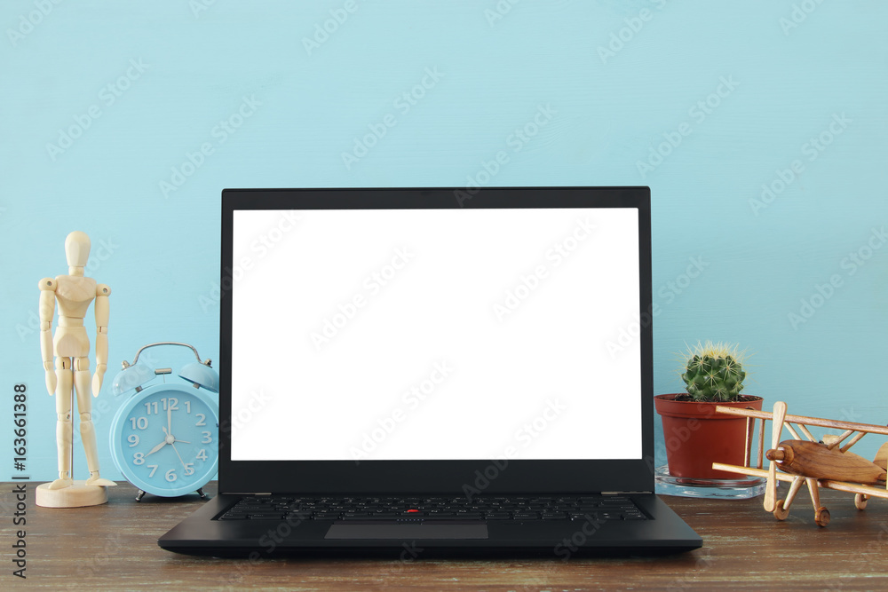 office work place with open leptop and empty white screen for copy space office work place with open leptop and empty white screen for copy space