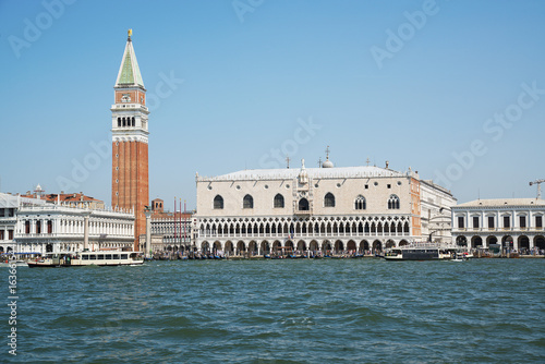 ITALY. VENICE - June 20, 2017: pleasure boats floating on the background of the bell tower of St. Mark's Cathedral and the Palazzo Ducale. © Ms VectorPlus