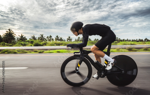 Asian men are cycling 
