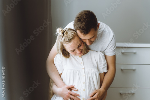 Beautiful pregnant woman and her handsome husband