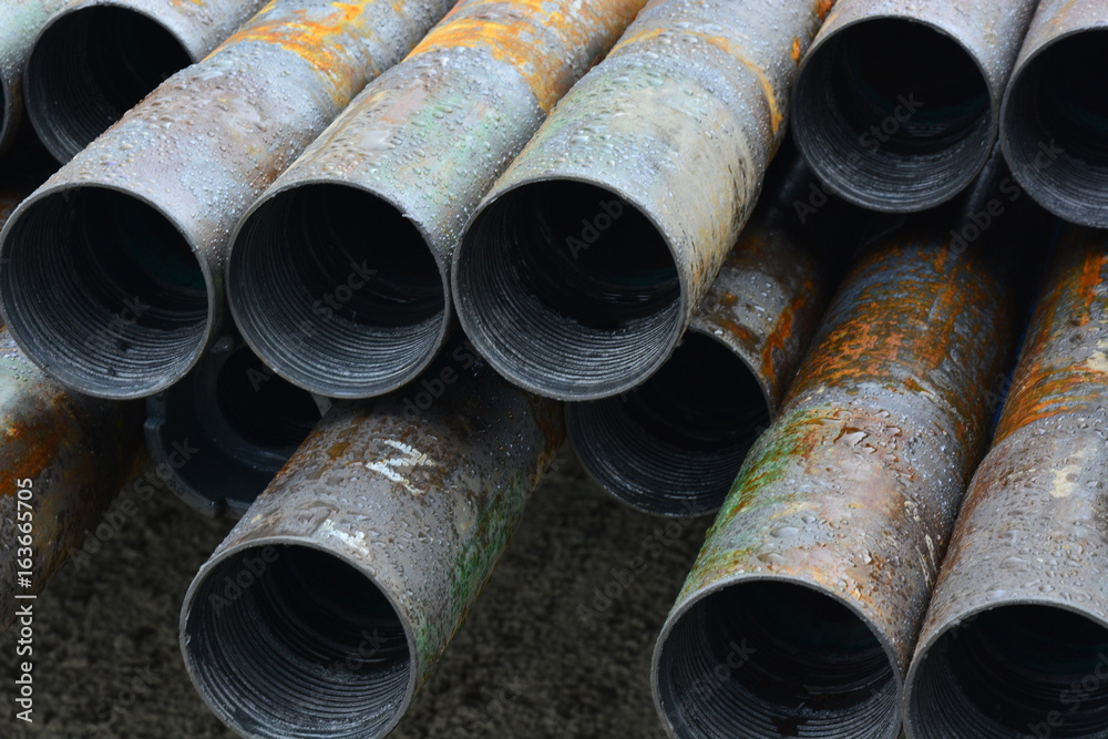 Pipes for drilling oil and gas wells stacked in a stack