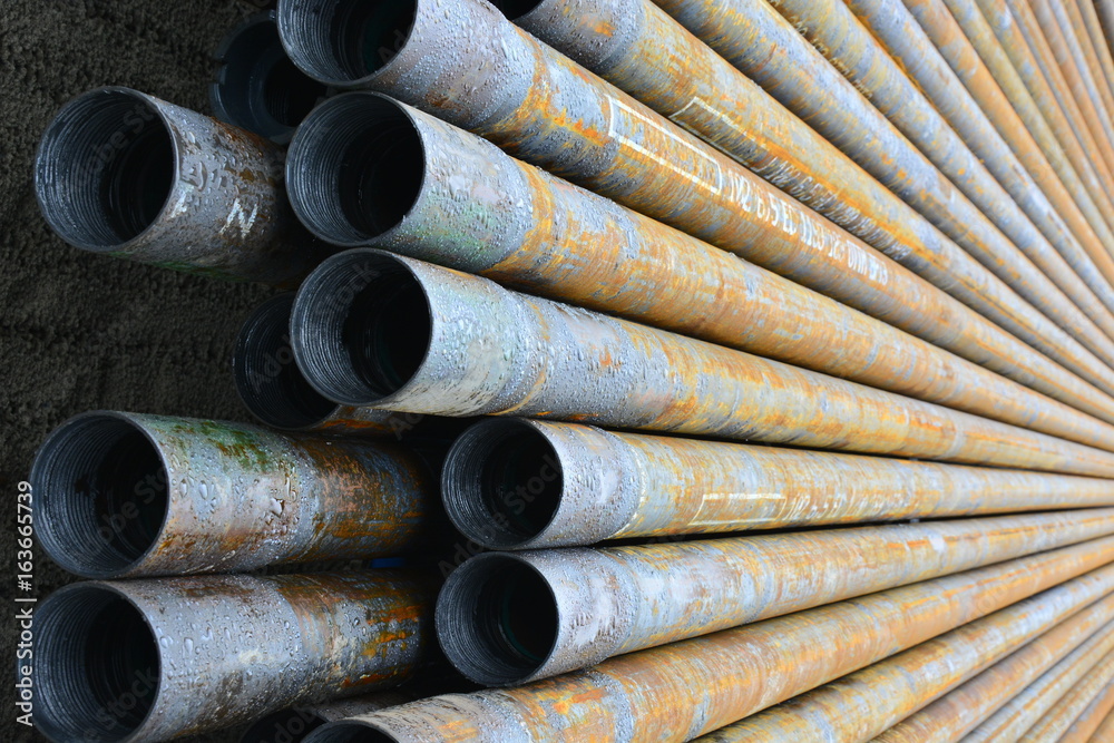 Pipes for drilling oil and gas wells stacked in a stack