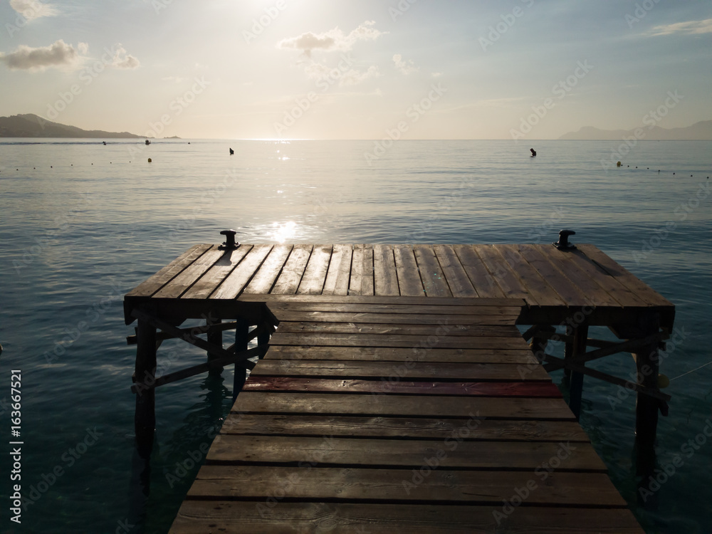 Obraz premium Wood boards old pier, Beautiful Mallorca landmark, Playa de Muro