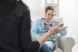  Young teenage girl with psychologist on therapy