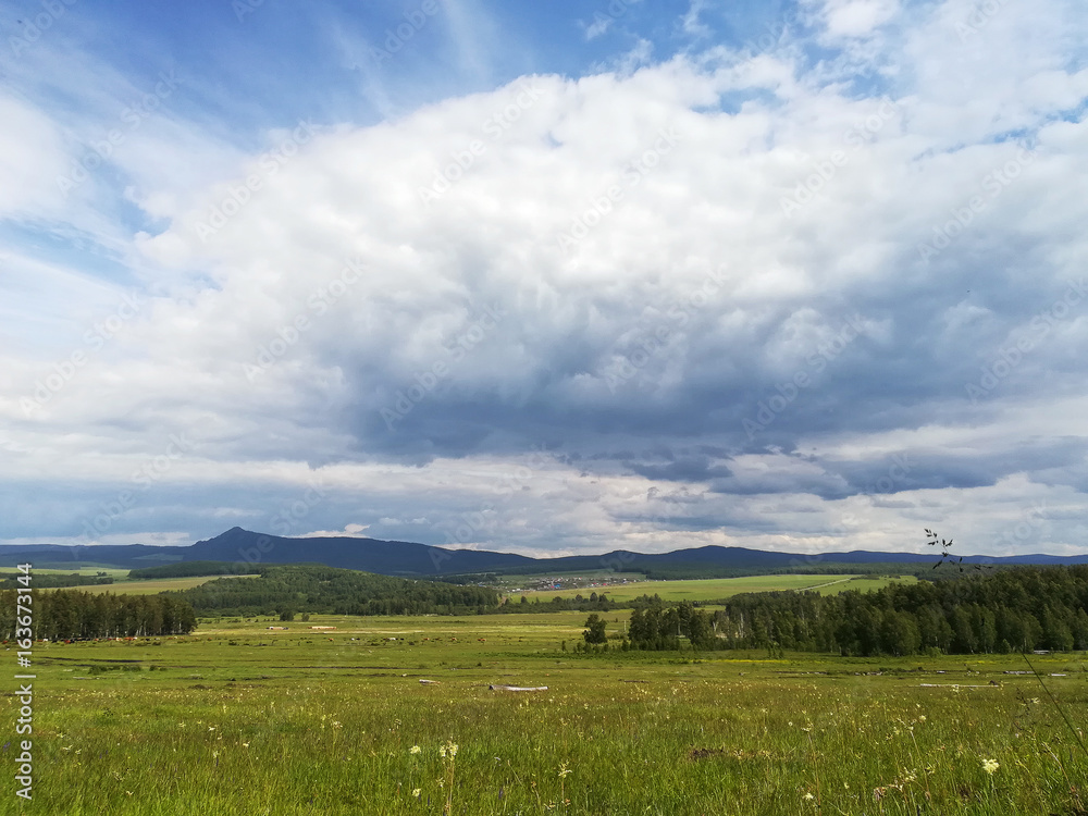 Rural summer landscape with blue sky with clouds. Rural summer landscape with blue sky with clouds.
