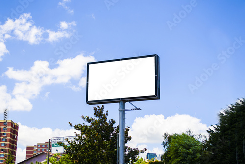 White blank billboard poster outdoor; Billboard blank with blue sky for outdoor advertising poster