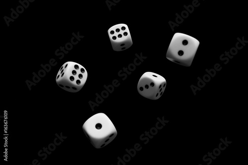 Flying dice in black background