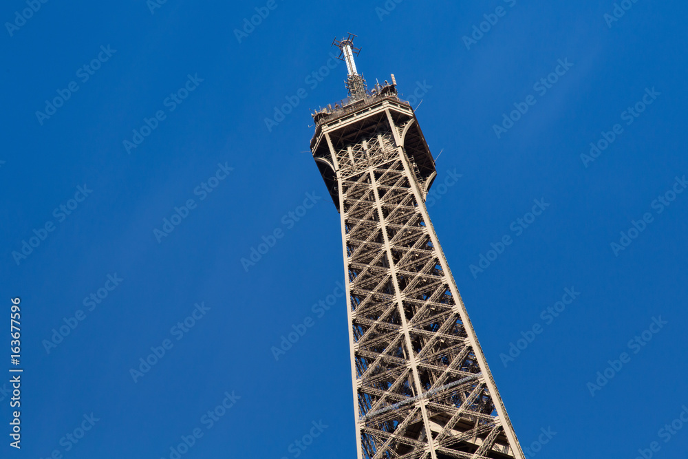 View of the detail of the Eiffel Tower in Paris. France. The Eiffel Tower was constructed from 1887-1889 as the entrance to the 1889 World's Fair by engineer Gustave Eiffel.