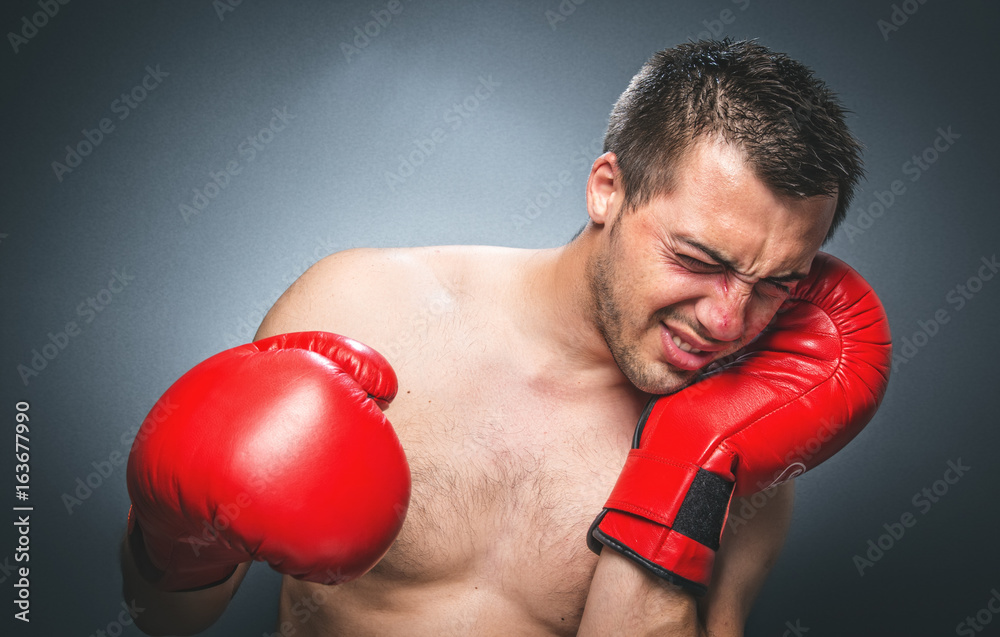 Beaten boxer crying