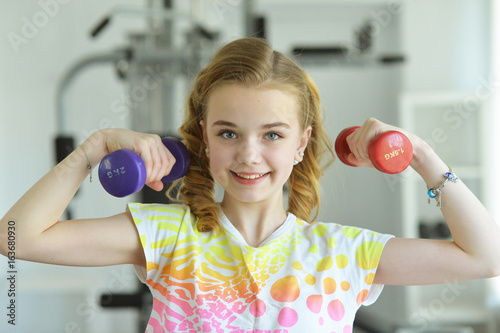 Cute little girl doing exercises 