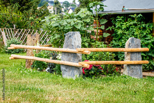 garden fence made of stone and wood