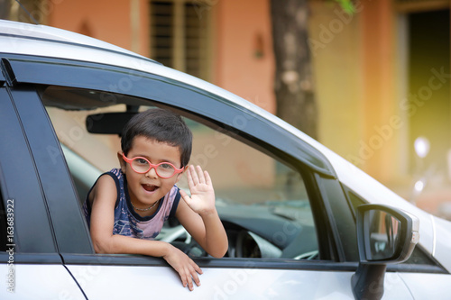 Indian child in car © Niks Ads