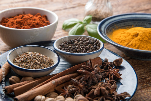 spices with ingredients on dark background. asian food, healthy or cooking concept. © Hyper Bee