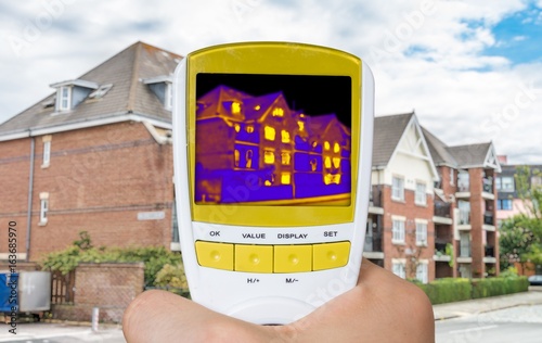Infrared thermovision image showing thermal insulation of house. photo