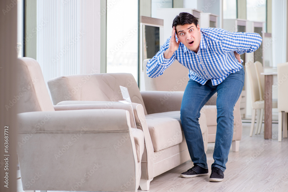 Young man shopping in furniture store