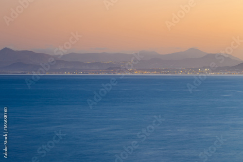 Fototapeta Naklejka Na Ścianę i Meble -  View of the island of Fuerteventura from Playa Blanca, Lanzarote