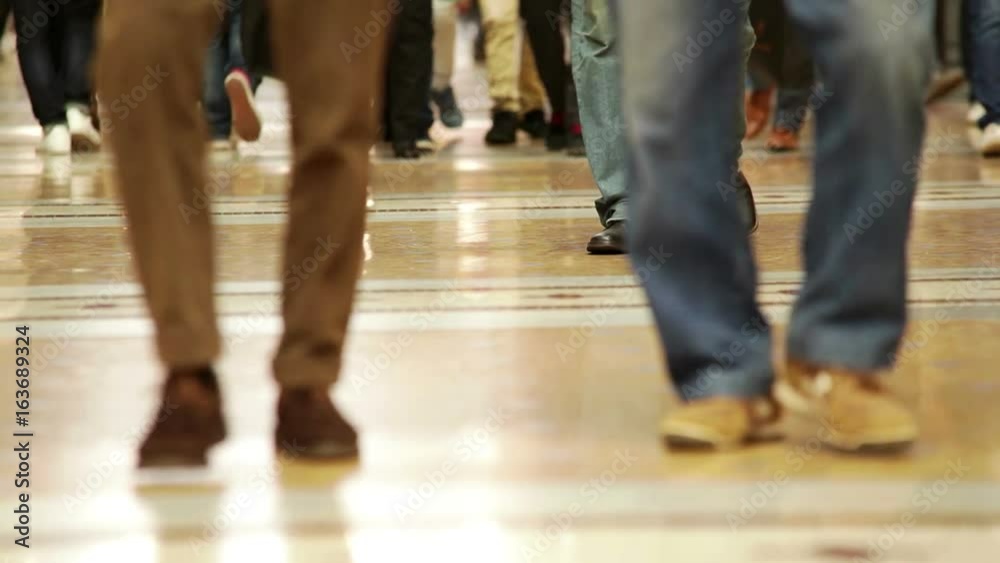 People walking in different directions wearing different shoes People walking in different directions wearing different shoes