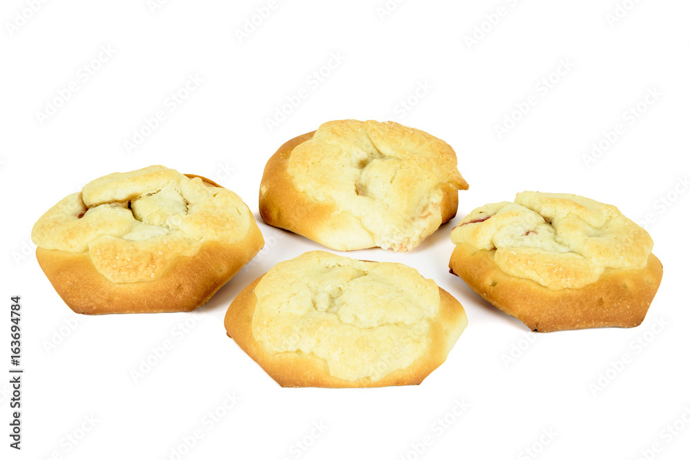 Four buns stuffed with plum isolated on white background