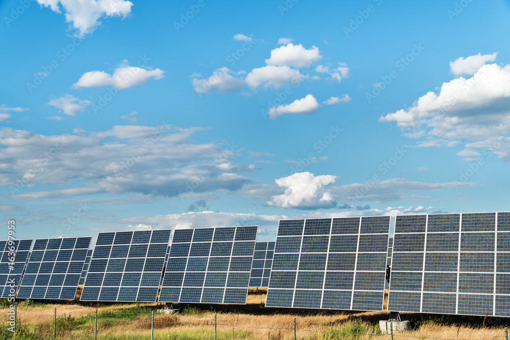 Solar power station with large panels under a cloudy sky Solar power station with large panels under a cloudy sky