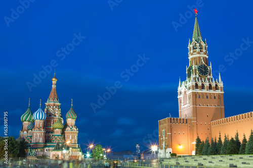 Blue hour sunset view of St. Basil Cathedral and Kremlin tower at Moscow Red Square. World famous Russian Moscow landmarks. Tourism and travel concept