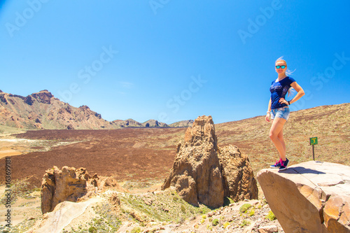 Beautiful girl posing by the Teide volcano on Tenerife island